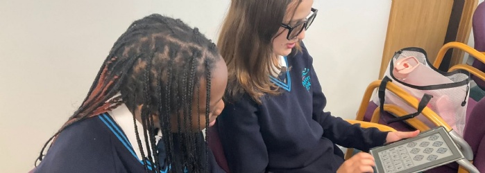 Students exploring vision testing equipment
